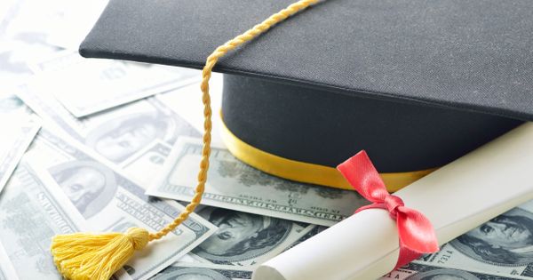 Student Graduation Cap on Top of Money