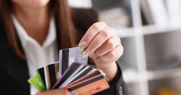 Young woman selecting a credit card