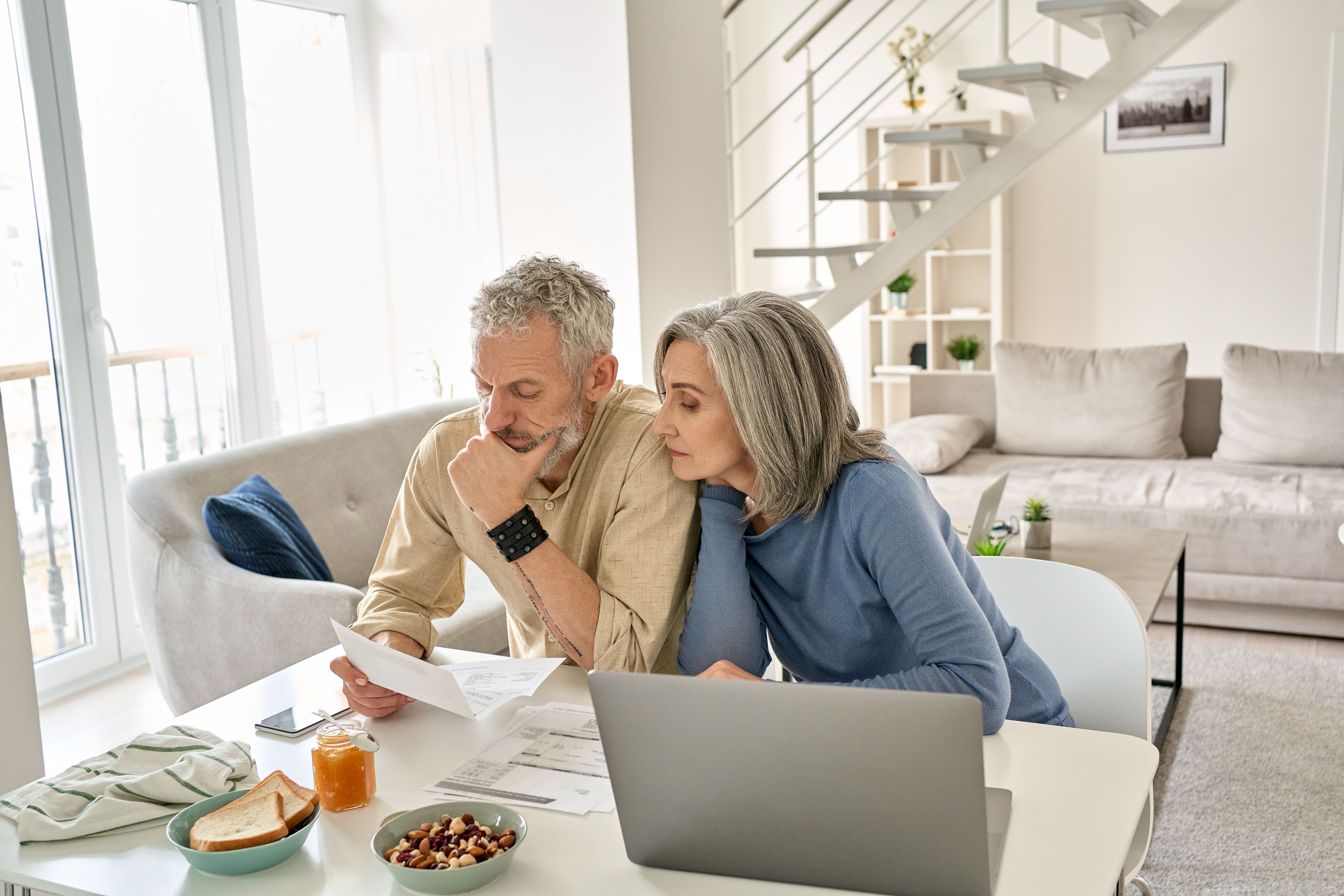 Middle-aged couple looking at retirement savings